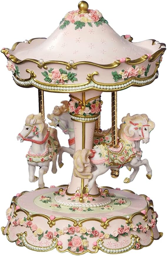 A decorative musical carousel featuring four ornate white horses, each adorned with colorful saddles, rotating under a pink canopy decorated with flowers and gold accents.