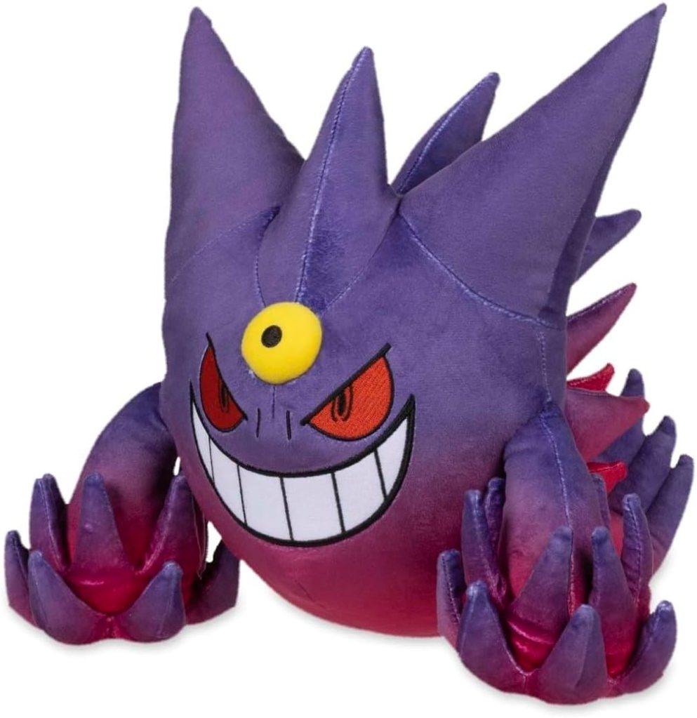 A plush toy of a purple, cartoonish creature with spiky features, a large grin, and red eyes, designed to resemble a popular gaming character.