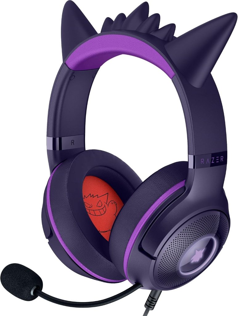A purple gaming headset with cat ear design and an attached microphone, featuring plush ear cushions with playful graphics.