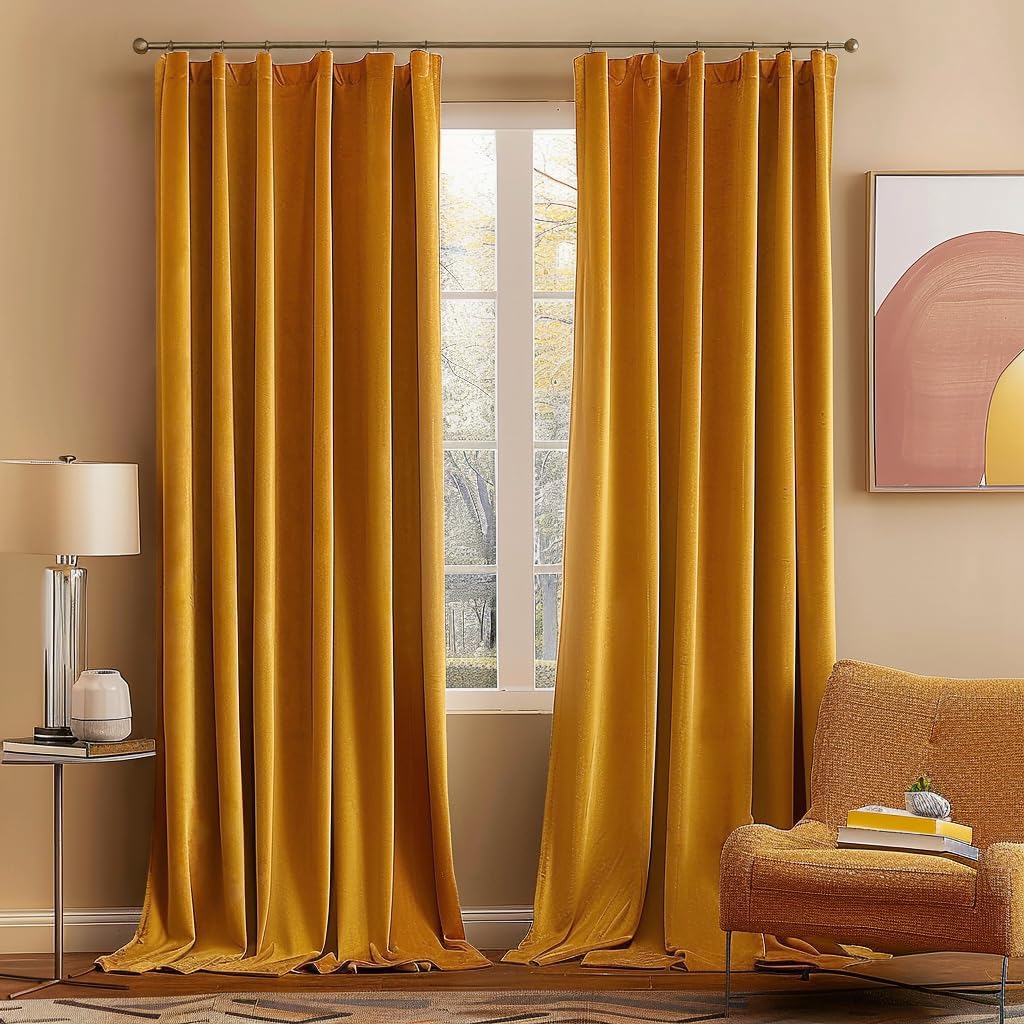 Vibrant mustard yellow curtains framing a window, with a cozy orange armchair nearby and a lamp on a side table.