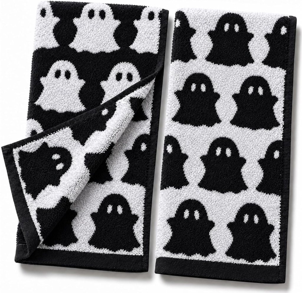 A pair of black and white towels featuring a ghost pattern, with alternating black and white ghosts on a light background.