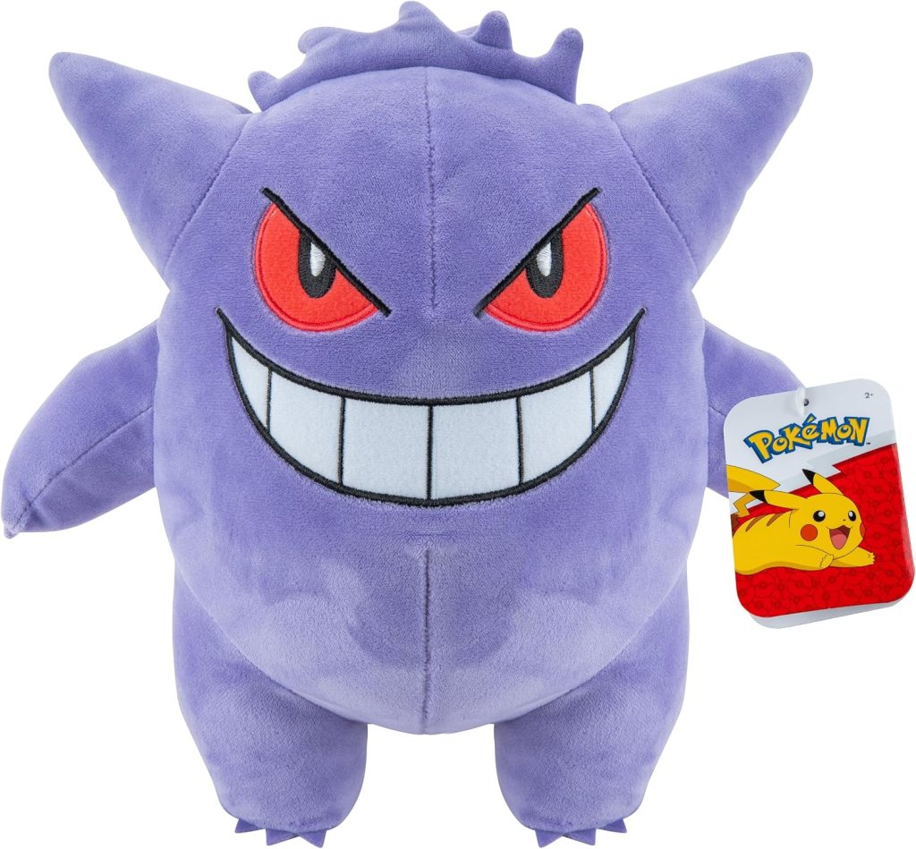 A purple plush toy of a Pokémon character with an oversized grin, red eyes, and pointy ears, featuring a tag with the Pokémon logo.